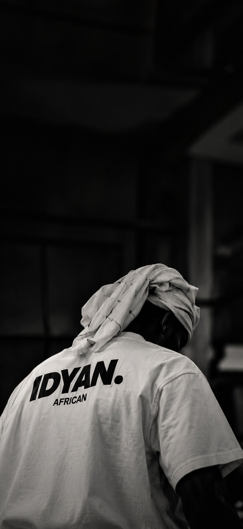 Man in an IDYAN. African tee, photographed in black and white