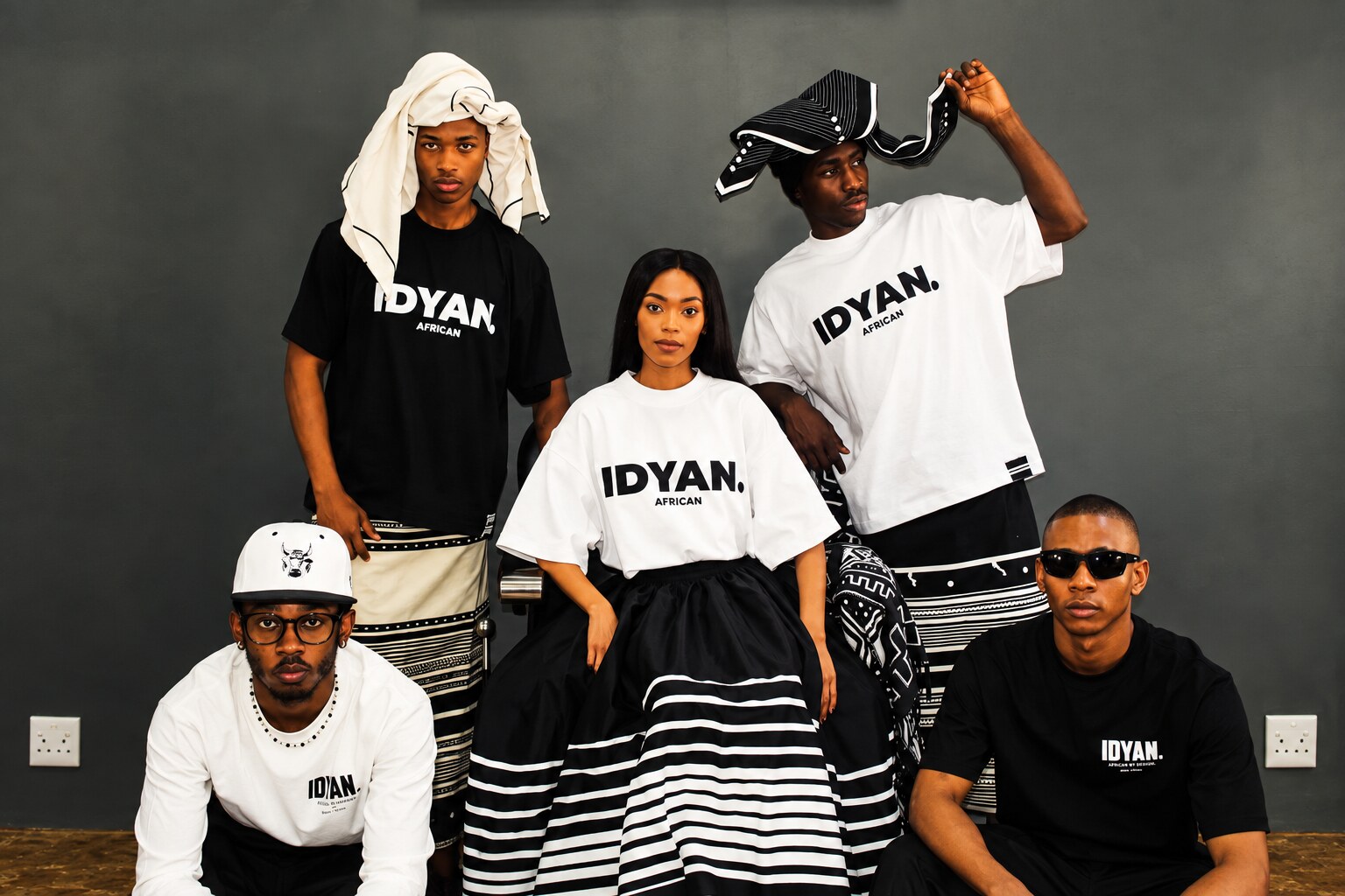 IDYAN community wearing black and white IDYAN. African tees